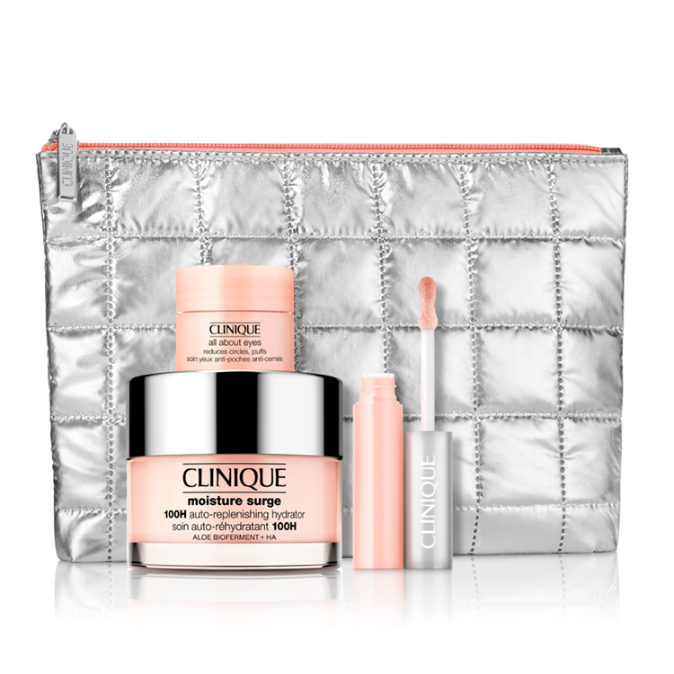 The 4pc Clinique Moisture Glow Set includes a quilted silver pouch, Moisture Surge 100H Auto-Replenishing Hydrator, All About Eyes cream, and a tinted lip balm.