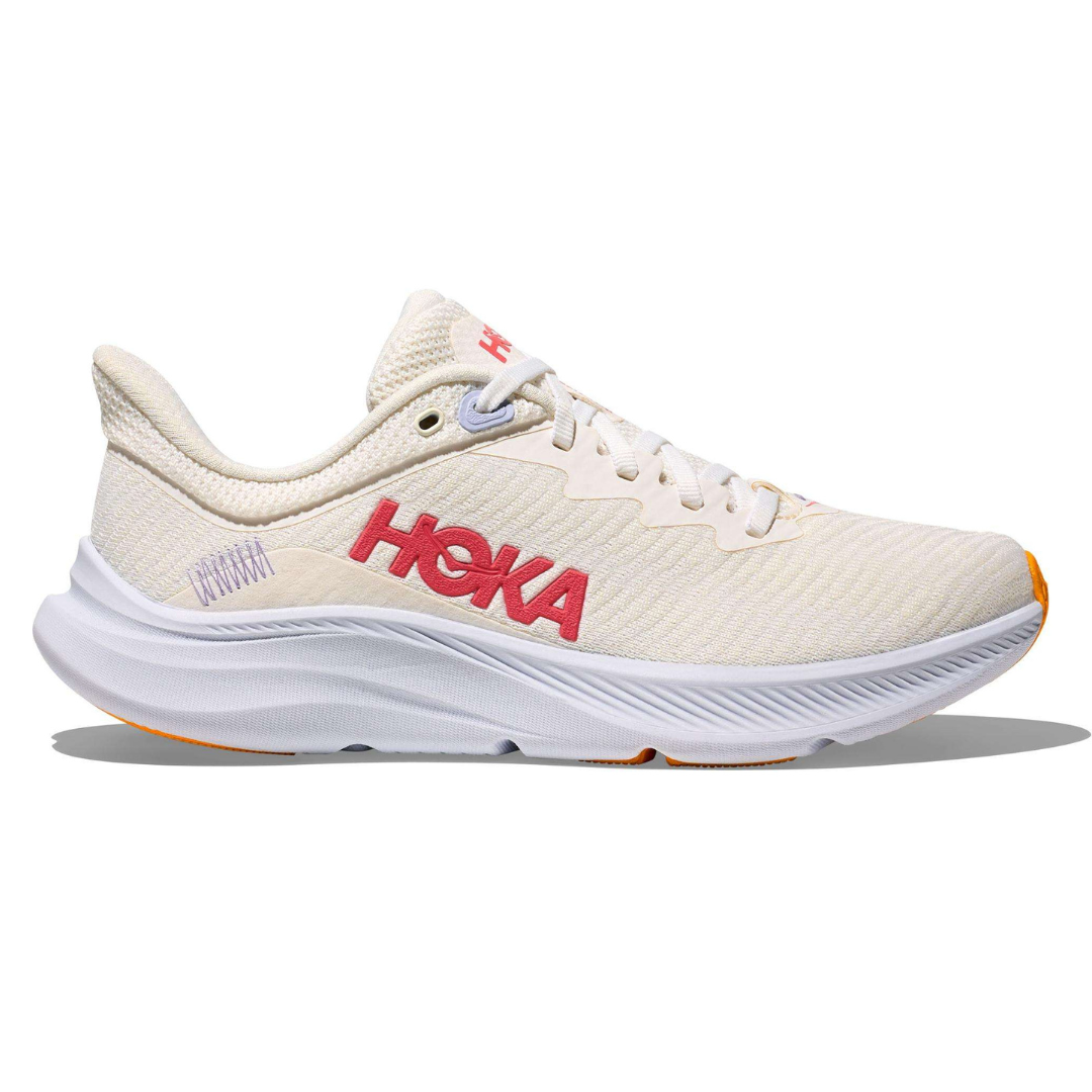 Hoka running shoe in off-white with pink logo, white midsole, and orange accents.