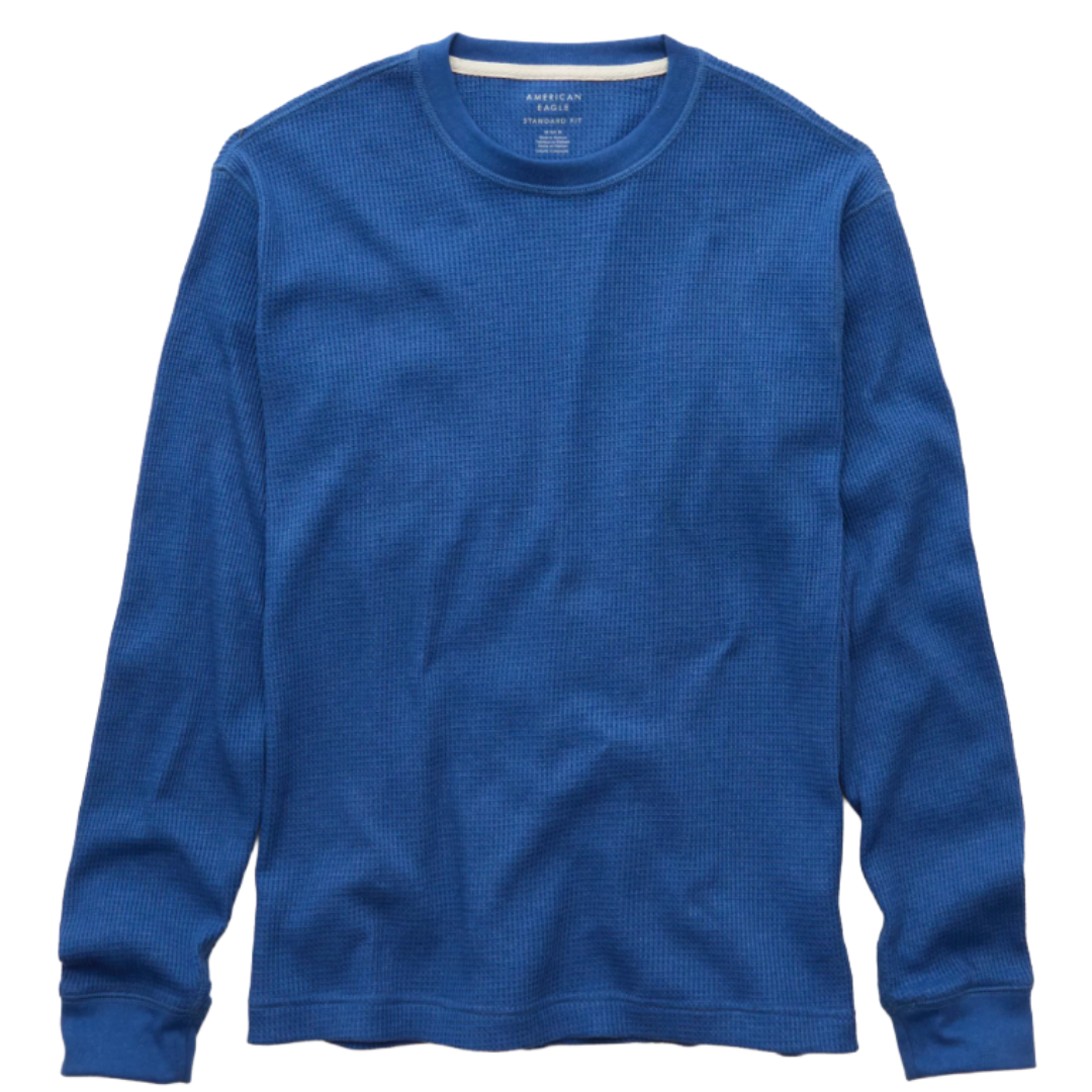 A blue long-sleeve waffle-knit thermal shirt with a crew neck, featuring ribbed cuffs and a casual fit.