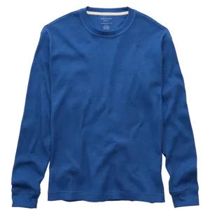 A blue long-sleeve waffle-knit thermal shirt with a crew neck, featuring ribbed cuffs and a casual fit.