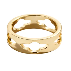 A gold ring featuring a cutout design with repeating shapes around the band, offering a modern and stylish look.