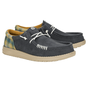 Hey Dude Wally Funk Shoes are casual slip-ons with a gray canvas upper, white stitching, plaid accents on the heel, and beige soles, featuring white laces threaded through side eyelets for a relaxed look.