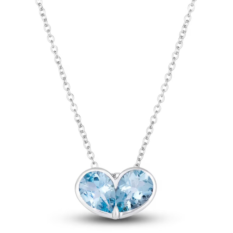 A necklace featuring a silver chain with two heart-shaped, light blue gemstones as the pendant.