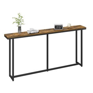 A narrow console table with a rustic wooden top and black metal frame, featuring a clock, books, a vase with green foliage, and a cup.