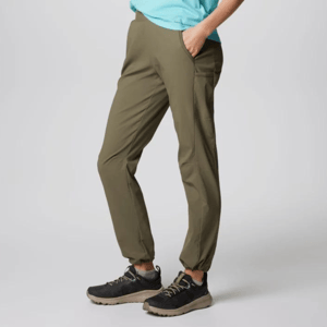 Olive green casual pants with side pockets paired with black and tan hiking shoes.