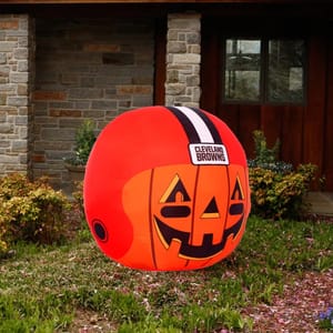 An inflatable Halloween decoration shaped like a pumpkin, featuring the Cleveland Browns football team logo.