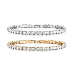 Two tennis bracelets featuring round diamonds, one set in white metal and the other in yellow metal.
