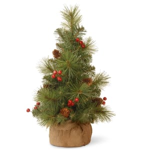 National Tree Co 18\“ Berry Tree features a small faux pine tree with red berries and pinecones, placed in a burlap-wrapped base.