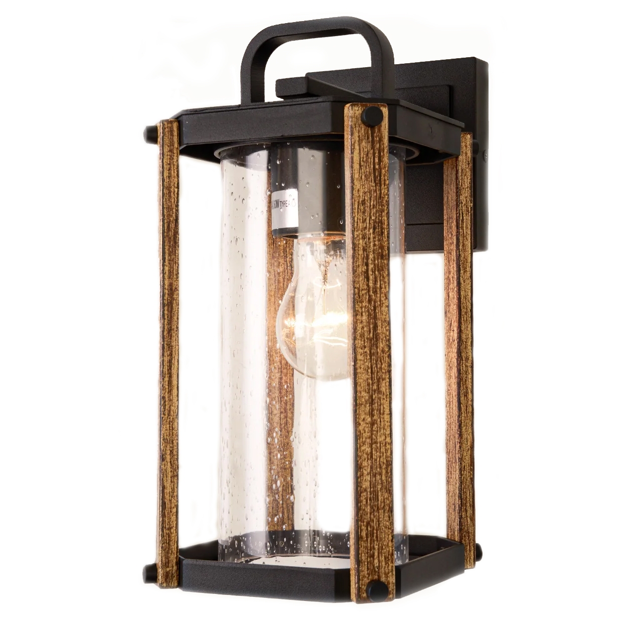 A wall-mounted outdoor light with a modern rustic design, featuring a black metal frame, wooden accents, and a clear cylindrical glass shade showcasing an exposed bulb.