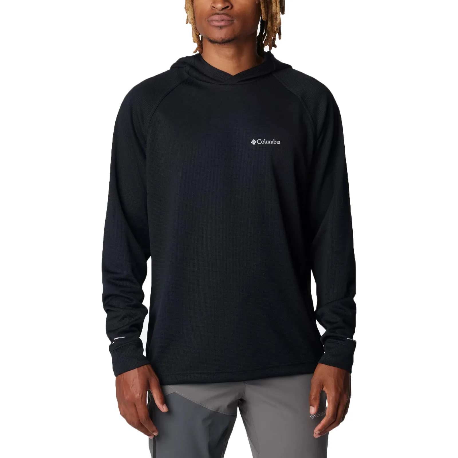 A person is wearing a black Columbia hoodie with a small logo on the chest, paired with gray pants.