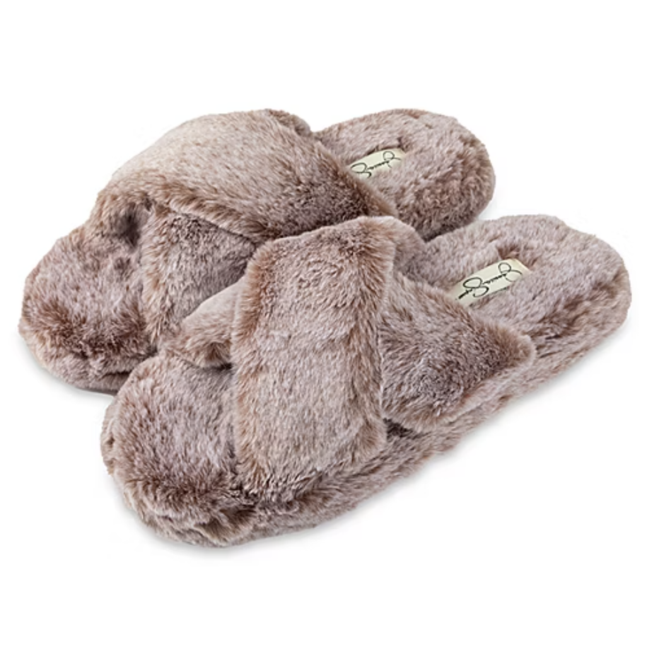 Furry slippers in a soft beige tone with a criss-cross design and an open-toe style, offering plush comfort for indoor wear.