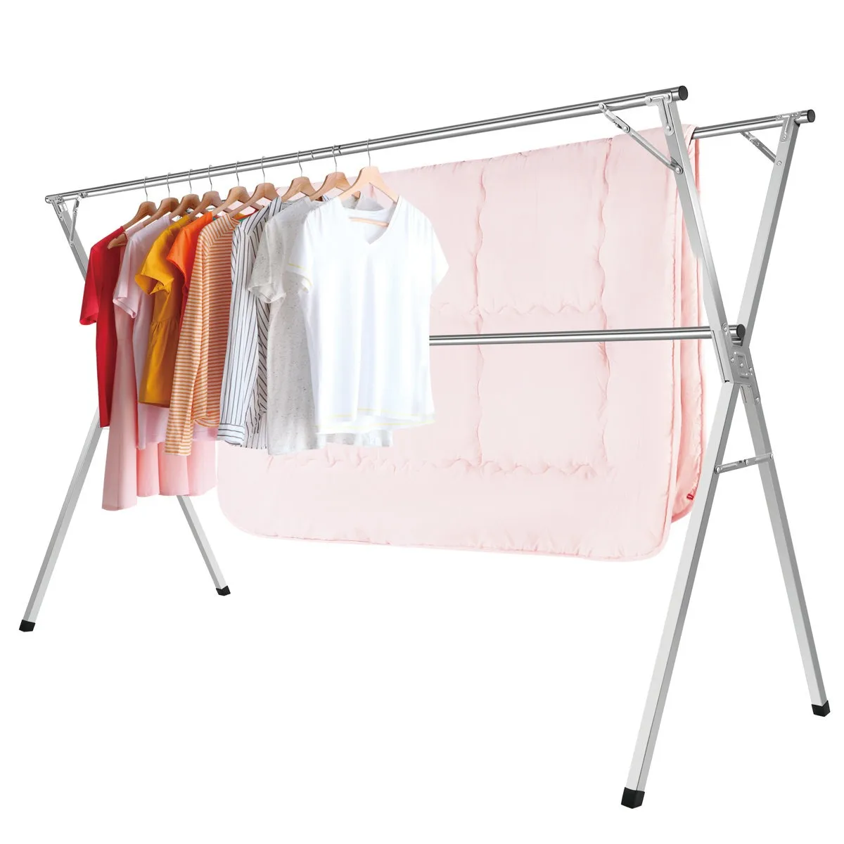 A metal clothes drying rack holds a row of colorful shirts on hangers, with a pink blanket draped over a lower bar. The rack is designed for efficient indoor or outdoor garment drying.