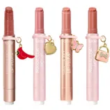 Four Tarte Maracuja Juicy Lip Plump products in various shades, each featuring a unique charm: a cardinal, a heart, a butterfly, and a handbag.