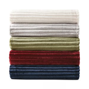 Stack of five ribbed blankets in white, gray, olive green, red, and navy blue.