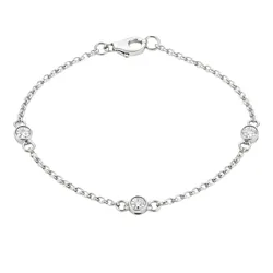 A delicate silver bracelet with a chain design featuring three evenly spaced round clear gemstones and a lobster clasp closure.