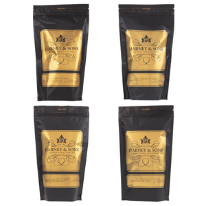 Four Harney & Sons tea blends in black and gold pouches. Varieties include Grey Supreme, English Breakfast, Paris, and Hot Cinnamon Spice, each containing 50 sachets.