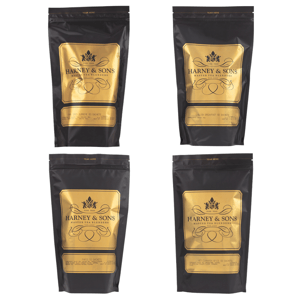Four Harney & Sons tea blends in black and gold pouches. Varieties include Grey Supreme, English Breakfast, Paris, and Hot Cinnamon Spice, each containing 50 sachets.