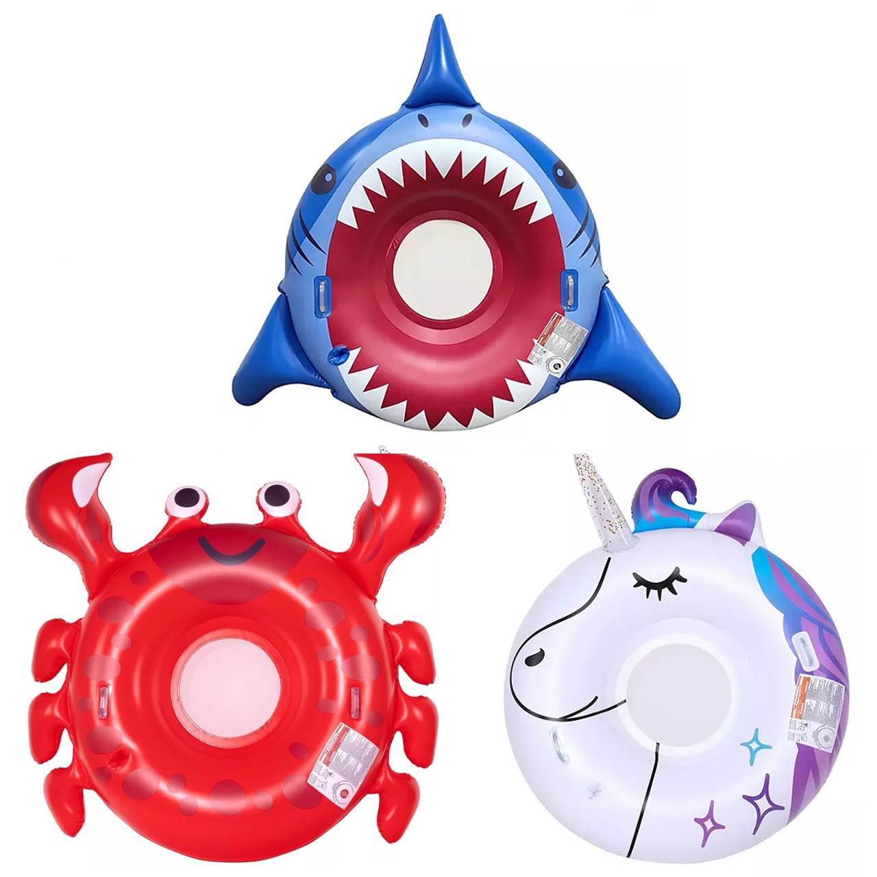 Three oversized inflatable pool floats are shown: a blue shark with an open mouth design, a cheerful red crab with front claws, and a white unicorn with a purple mane and horn.