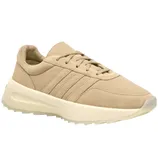 A beige sneaker with a thick, off-white sole and three parallel stripes on the side, featuring a lace-up design.