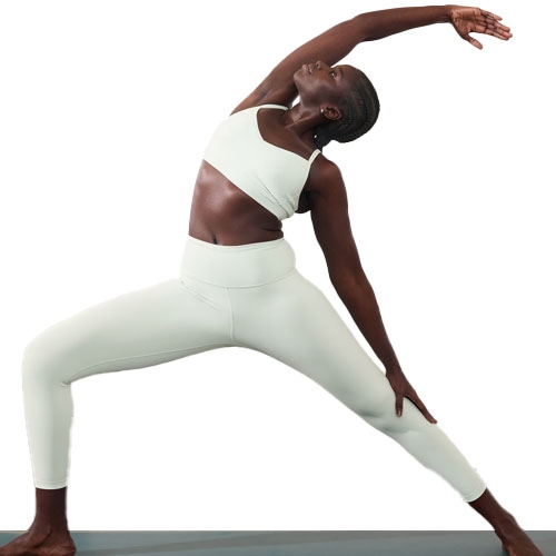 The Elation 7/8 Leggings are light gray, high-waisted, and designed for flexibility and comfort. They feature a smooth finish and no visible seams, ideal for active wear.