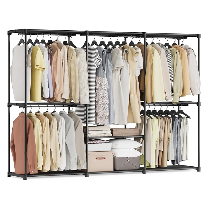 A freestanding wardrobe with a metal frame features clothing on hangers, multiple storage shelves, folded clothes, and boxes.