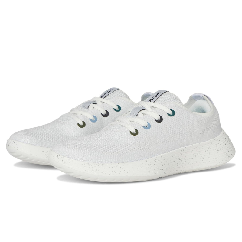 White athletic sneakers with a speckled sole and color-accented eyelets.