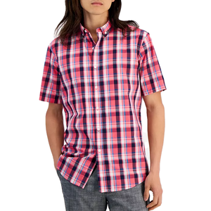 A short-sleeve, button-up, all-cotton shirt featuring a vibrant pink, navy, and white plaid pattern. The shirt has a classic collar and a relaxed fit, paired with gray pants.