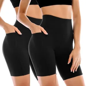 Two pairs of black high-waisted biker shorts with side pockets, designed for a snug fit, are shown.