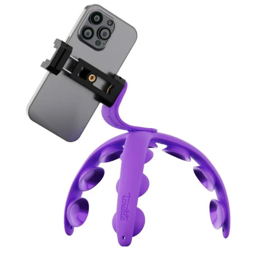 A phone mount with a purple suction-cup base designed to securely hold a smartphone. The flexible legs and suction cups allow for versatile positioning on various surfaces.