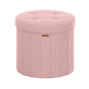 Round pink ottoman with tufted top, vertical seams, and a small label in the front.