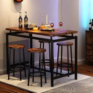 A wooden dining table set with a dark metal frame, featuring four matching stools. The table is decorated with bottles, candles, glasses, and plates, placed on a patterned rug in a cozy corner.