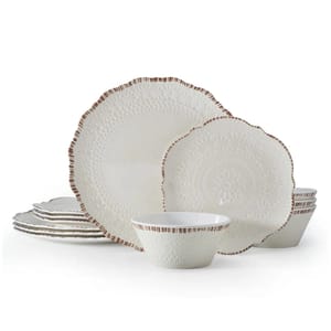 The 12pc Pfaltzgraff Dinnerware Set features embossed white plates and bowls with scalloped edges and a brown rim detail. The set includes dinner plates, salad plates, and bowls, all showcasing intricate patterns.