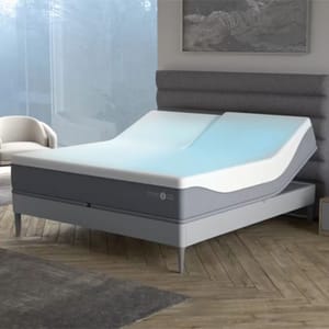Adjustable bed with a curved memory foam mattress, featuring a dual-zone design for customizable comfort, shown in a modern bedroom setting.