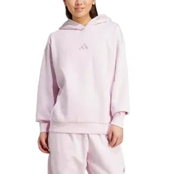 A person is wearing a light pink Adidas hoodie and matching sweatpants. The hoodie features the Adidas logo on the front.
