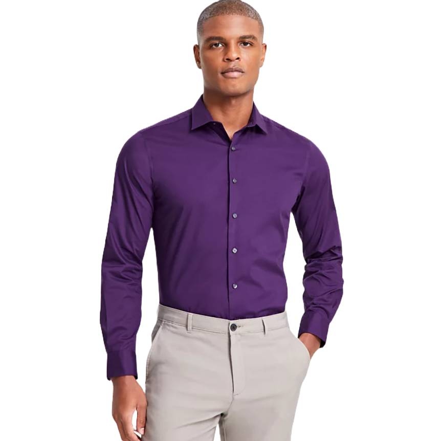 A man wears a deep purple Alfani dress shirt with long sleeves, a classic collar, and button-up front, paired with light-colored pants.