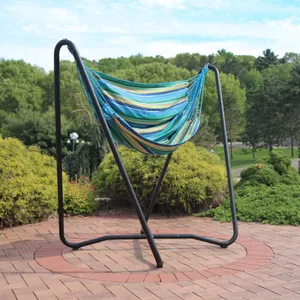 A colorful striped hanging hammock chair with a black metal stand, outdoors on a patio.