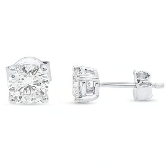 Diamond stud earrings set in a four-prong setting with butterfly backings, featuring round-cut stones and silver metal.