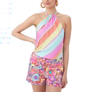 The Trina Turk Tamika Top features a sleeveless, halter-neck style with diagonal pastel stripes in pink, yellow, green, blue, and orange.