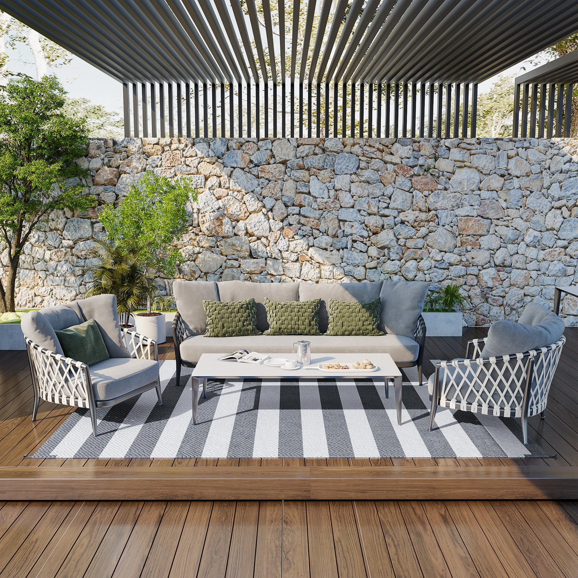 A 12' reversible outdoor rug with a striped pattern, featuring alternating light and dark colors, placed beneath outdoor seating on a wooden deck.