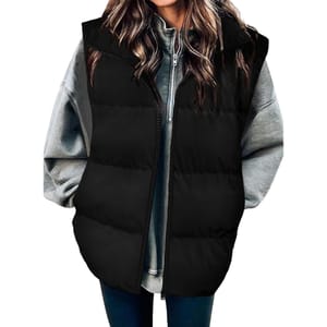 A black women's puffer vest featuring a quilted design, front zipper, and two pockets, worn over a gray hoodie.