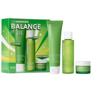 This Ole Henriksen 3-piece skin care set includes a facial cleanser, a toner, and a moisturizer, all in green packaging with white and yellow accents.