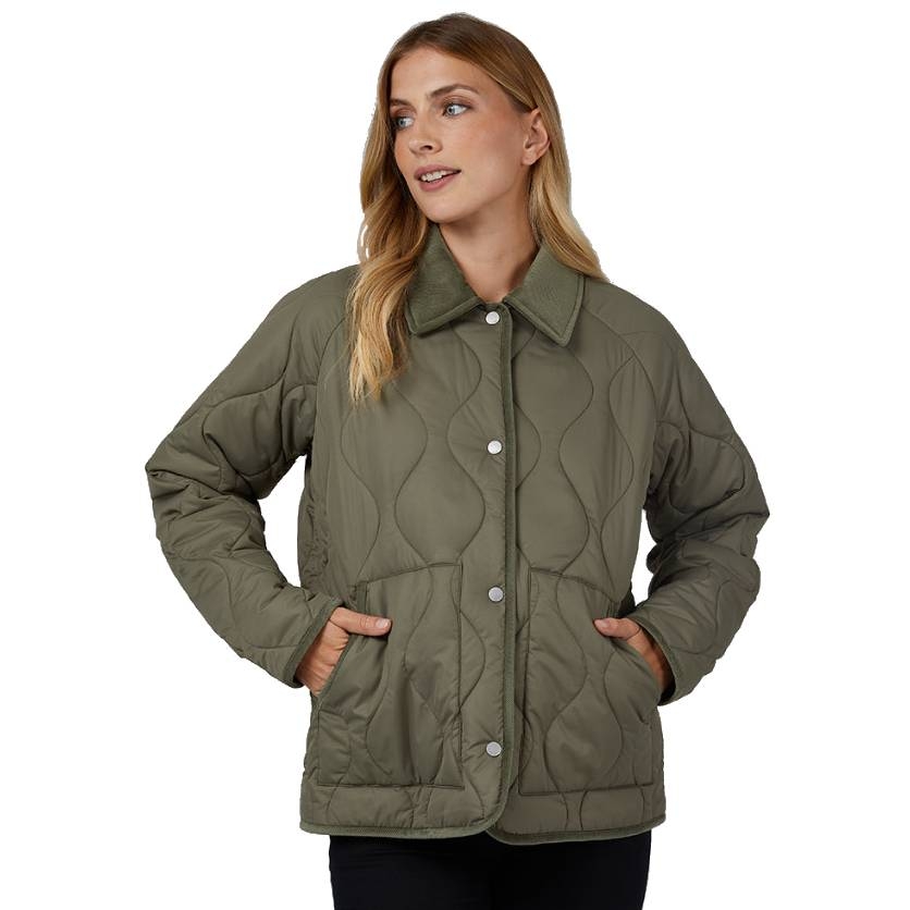 A woman wearing a quilted, olive green jacket with a button front and two side pockets. The jacket features a wave pattern design and a collared neckline.