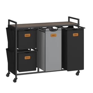 A laundry station with four labeled compartments: \“Towels,\“ \“Smalls,\“ \“Light,\“ and \“Dark.\“ It features a metal frame with a top shelf and wheels for mobility.