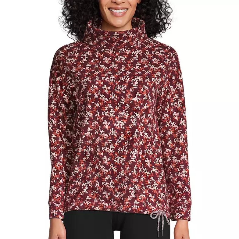 A floral-patterned, long-sleeve top with a cowl neck and drawstring detail at the hem, featuring a burgundy color scheme with small white flowers.
