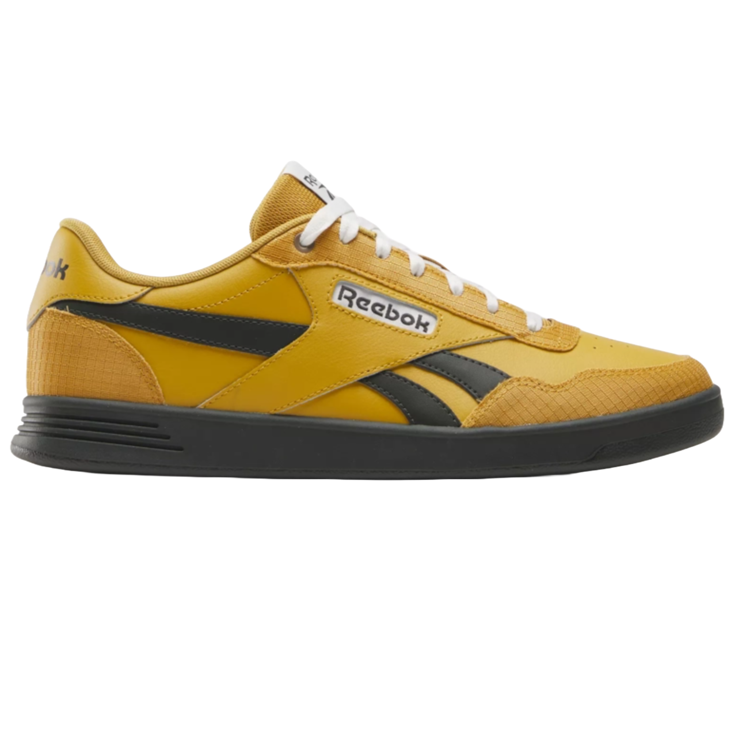 Yellow and black Reebok sneaker with white laces, featuring a classic low-top design and a sturdy black sole.