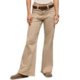 A person is wearing beige flared pants with a brown belt, brown shoes, and several bangles on one wrist. The top is a cropped white shirt.