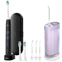 Philips Sonicare electric toothbrush with travel case and three brush heads beside a purple cordless water flosser and three additional nozzle attachments.