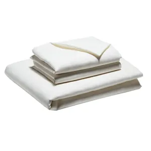 A set of neatly folded, cream-colored bed linens, including a fitted sheet, a flat sheet, and pillowcases.