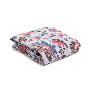 Folded blanket with a floral pattern featuring blue, pink, and brown flowers on a light gray background.
