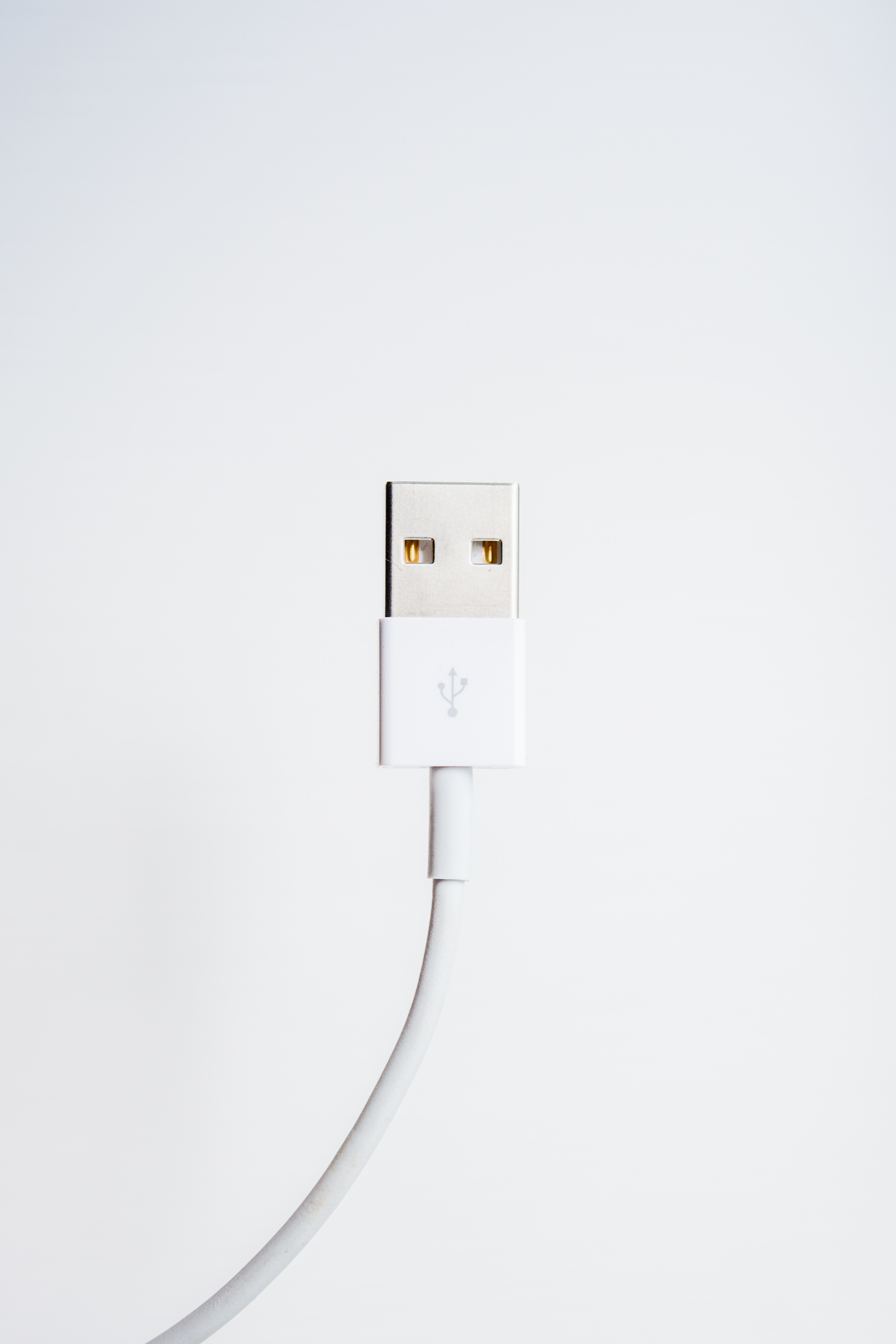 White USB cable against a plain background.